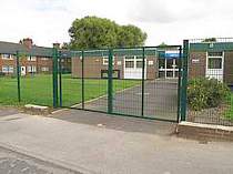 Double leaf green powder coated mesh in-filled entrance gates