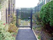 Black powder coated vertical bar access gate complete with padlock cover hoods
