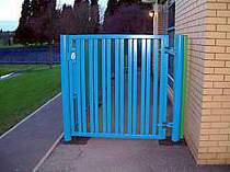 Blue powder coated vertical tube in-filled gate with mechanical key pad access lock