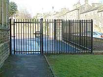 Black powder coated vertical bar access gate