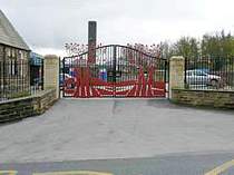 Powder coated entrance gates in-filled with custom art designed steel work