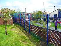 Blue powder coated V-Beam mesh panel fencing - mesh panels supported on 60x60mm square tube fence posts