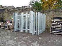 Galvanised palisade fence compound with a single leaf full width access gate