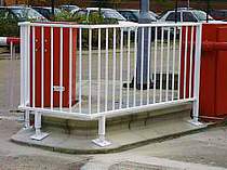 Pedestrian railings located between automatic barrier units