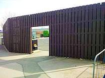 Hit & Miss 3000mm vertical wood pale screen fence with brown wood stain